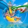 A smiling couple riding an inflatable tube down a water slide at KUZA Waterpark in Cozumel